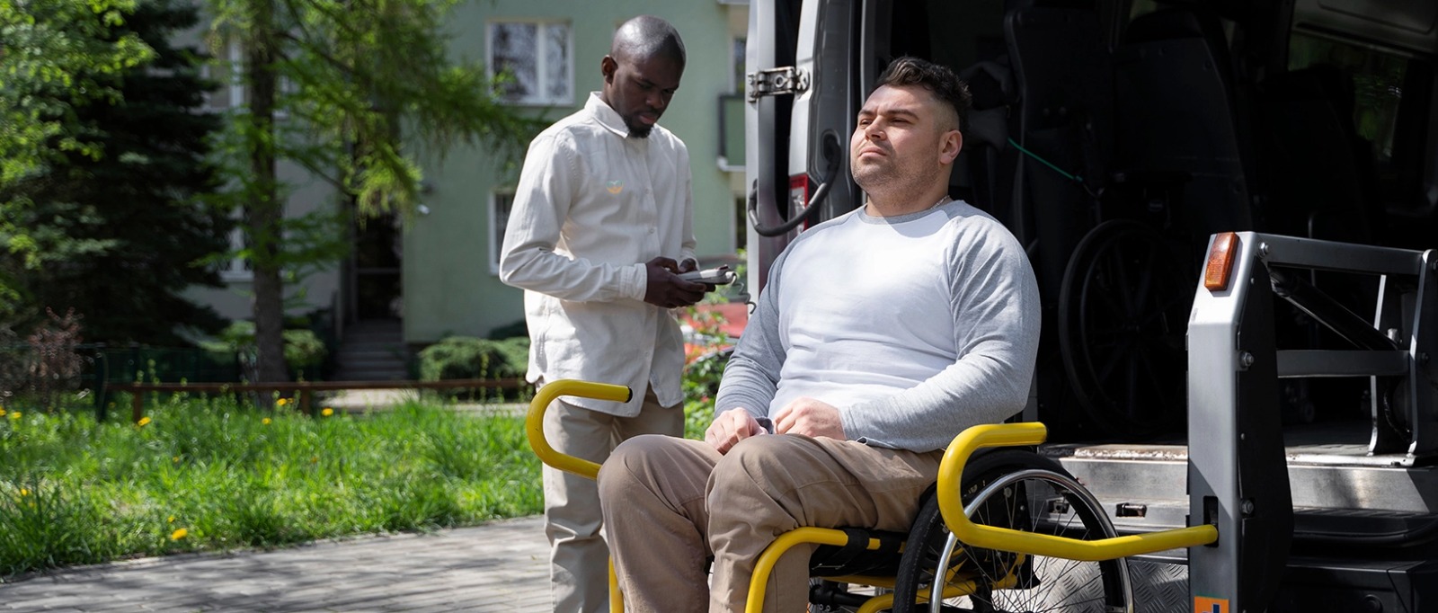 A I Love Open Arms caregiver and an elderly woman smile together as they tend to potted plants outdoors, emphasizing companionship and shared hobbies.